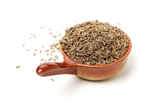 cumin seeds on white background