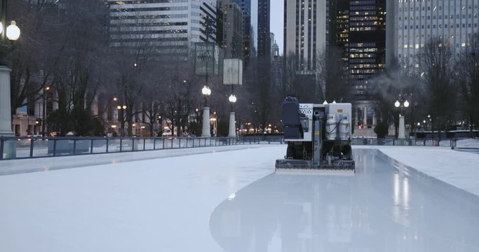 Ice resurfacer moving on ice rink - close up