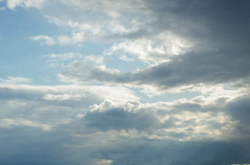 Clouds in the blue sky with breaking light