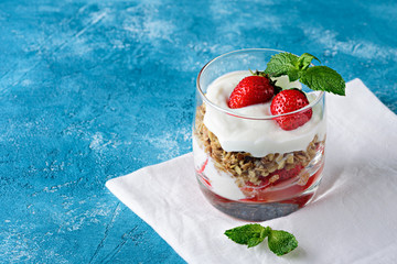 Vegan dessert with granola, ricotta cheese and strawberries with copy space