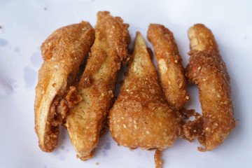 Banana fry in a pan with boiling oil. When finished, looks very appetizing