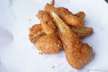 Banana fry in a pan with boiling oil. When finished, looks very appetizing