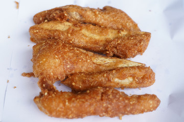 Banana fry in a pan with boiling oil. When finished, looks very appetizing