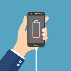 Hand holding smartphone with charger connected and low battery icon on screen. Flat vector illustration