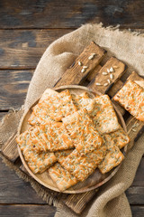 Delicious cookies with seeds on a wooden Board on a wooden table