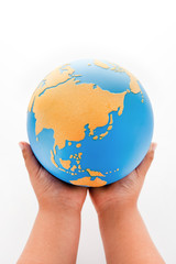 Globe And Children's Hand.