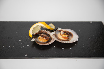 scallops with lemon, typical tapa in galicia spain