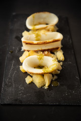 Spanish squid top with potatoes