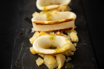 Spanish squid top with potatoes