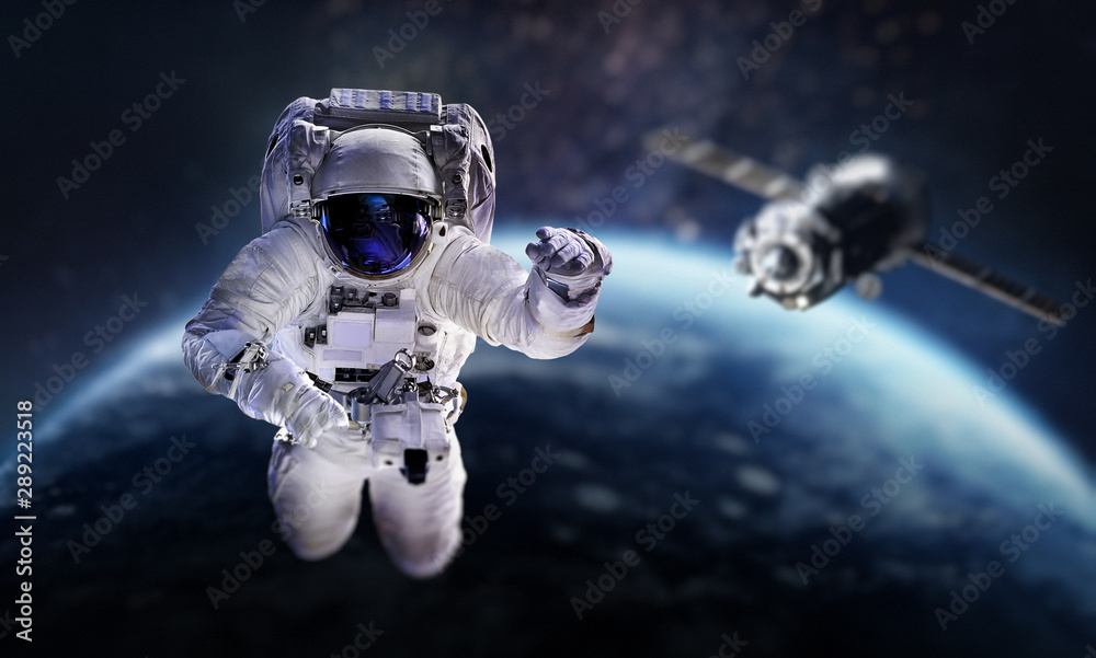 Poster Astronaut in the outer space over the planet Earth. Space craft behind. Spaceship. Spaceman. Elements of this image furnished by NASA