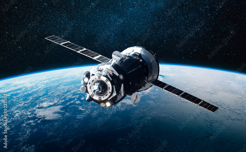Poster cargo space ship on orbit of the earth planet. milky way on background. elements of this image furni