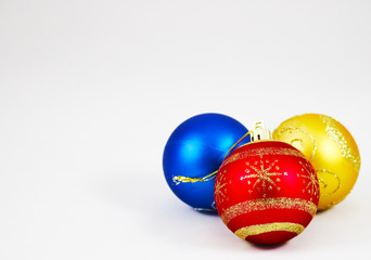 Three colorful christmas balls isolated on a white background 