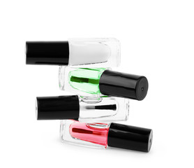 Stack of nail polishes on a white background