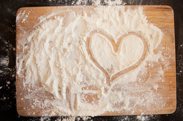 sprinkled flour on the board, heart, love cooking at home