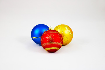 Three colorful christmas balls isolated on a white background 