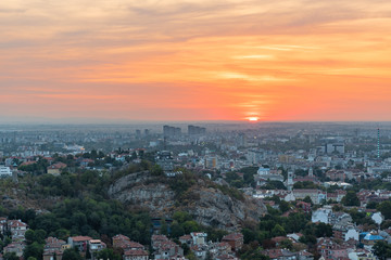 Fototapeta na wymiar Beautiful sunrise with pink and yellow clouds above Plovdiv city 