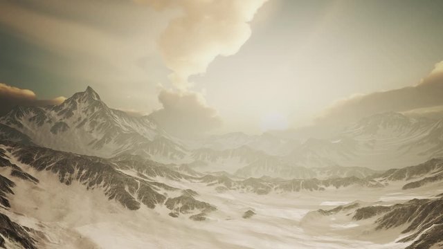 rays of sunset on the tops of the mountains on a sunny day