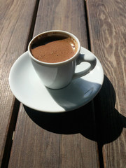 Cup of coffee on wooden table