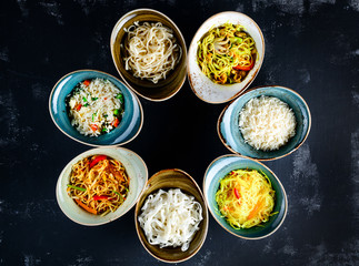 asian dishes in plates on table