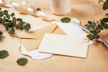 Seasonal letter with a vintage feather quill pen on wooden background