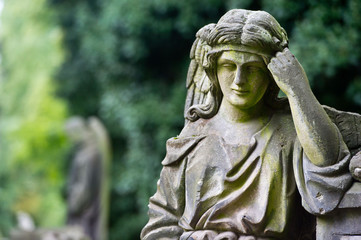 Fototapeta premium Sculpture of Angel at a Prague cemetery. Czech Republic. Sculpture elements.