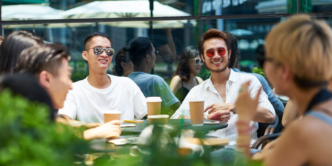 young asian people relaxing in coffee shop