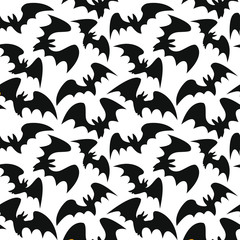 Seamless Halloween pattern with bats silhouettes for greeting card, gift box, wallpaper, fabric, web design. Isolated on white.