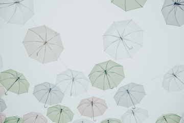 pastel tone Colorful umbrellas background. Colorful umbrellas in the sky © Poramet
