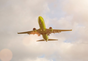 plane flying on the background the sky with clouds.