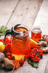 Healthy food immune boosting selection. Cold and flu remedy relief. High in antioxidants, minerals and vitamins. Hot tea with berry and fruit, winter autumn beverage concept