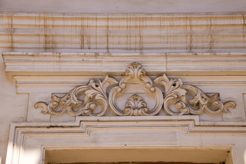 Rybinsk. The building of the old grain exchange. Stucco decoration of the window opening.