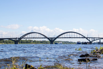Fototapeta na wymiar reinforced concrete arched road bridge over the Volga river in Rybinsk.