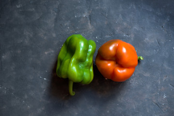 two peppers fresh on a dark background. top view. autumn harvest