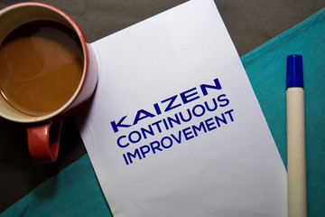 KAIZEN. Continuouse Improvement text on the paper isolated on office desk background. Japanese Concept