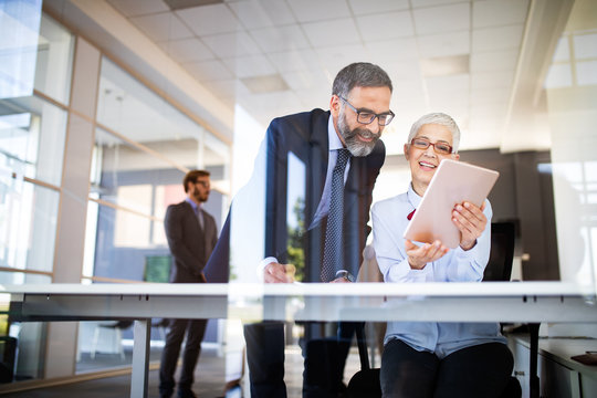 Collaboration and analysis by business people working in office