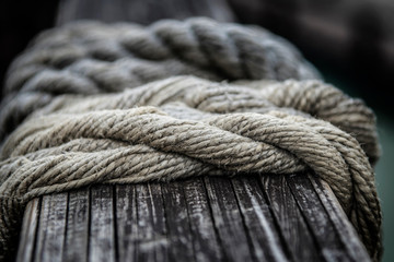Fototapeta na wymiar Ropes from an old sailing boat, close-up, shallow depth of field.