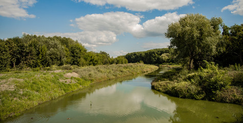 Eastern European country side scenic view of river stream between green park foliage natural environment space 