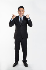 Man in suit showing thumbs up.