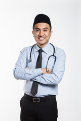 Asian male doctor with songkok holding.