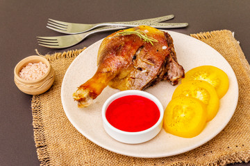 Crusty roasted duck leg. Traditional French food confit preparation