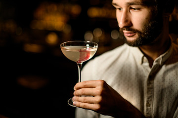 Portrait of bartender with an alcohol cocktail