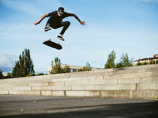 Fototapeta na wymiar Skateboarder doing a trick on the skateboard