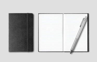 Black closed and open notebooks with pen isolated on grey