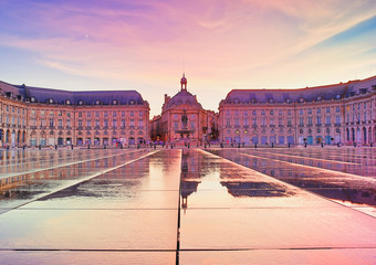 Colorful sunset at Place de la Bourse square in Bordeaux, France, one of the most visited and photographed sites in the Gironde Capital.