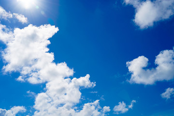 Blue sky and white clouds background.