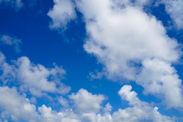 Blue sky and white clouds background.