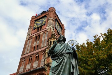 The Nicolaus Copernicus Monument in Torun - home town of astronomer Nicolaus Copernicus. Statue in front of the Old Town Hall, Torun, Poland.  