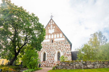 Naklejka premium Hollola, Finland - 9 September 2019: Old medieval stone church of St. Mary in Hollola, Finland