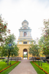 Hollola, Finland - 9 September 2019: Bell tower of old medieval stone church of St. Mary in Hollola, Finland