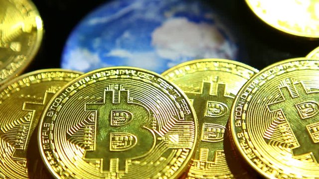 Bit coin with world globe rotating in studio, Chiangmai Thailand
